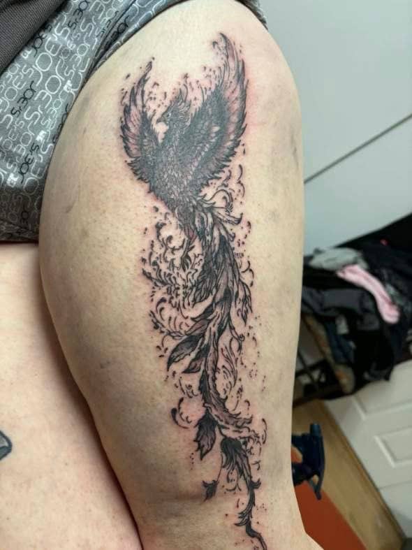 Tattoo by Jake Brewer, phoenix with a trailing tail in black and grey