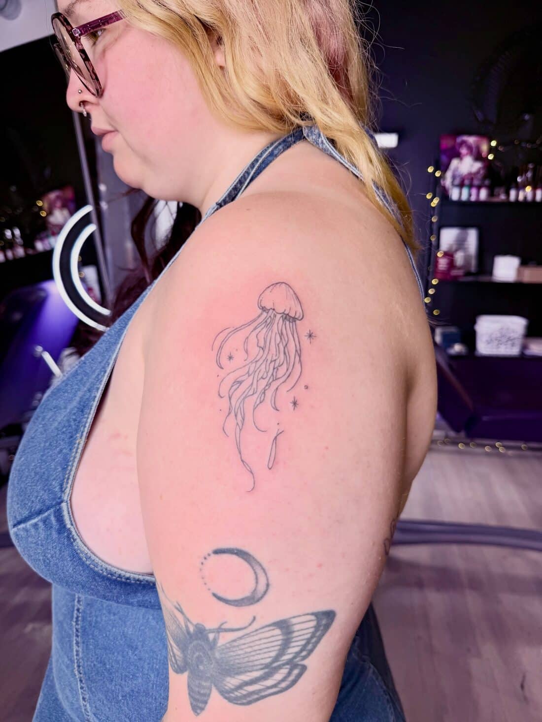 Tattoo by Apollonia Ink in Barrie, fine line jellyfish on an upper arm
