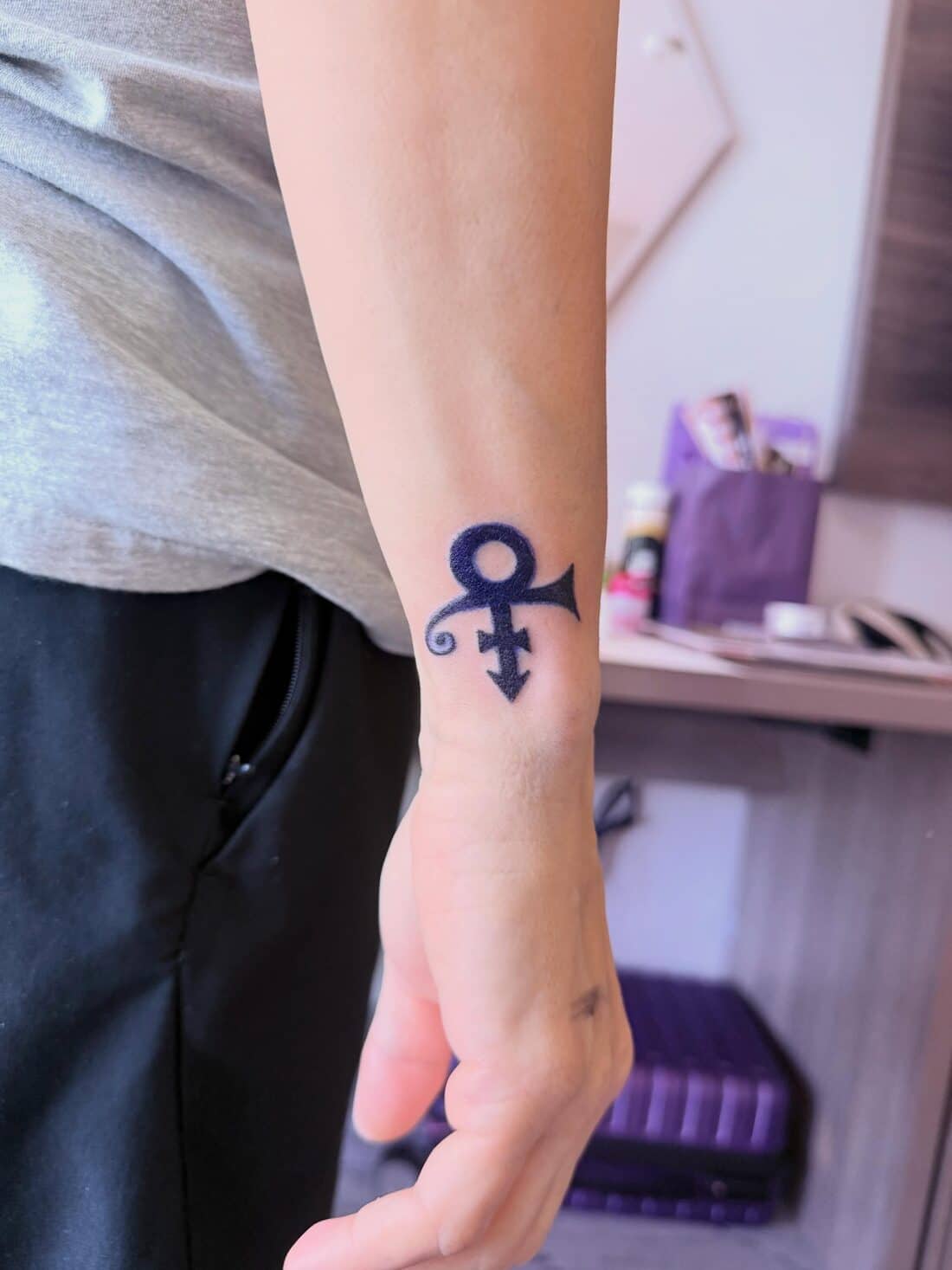 Tattoo by Apollonia Ink in Barrie, Prince love symbol on the wrist